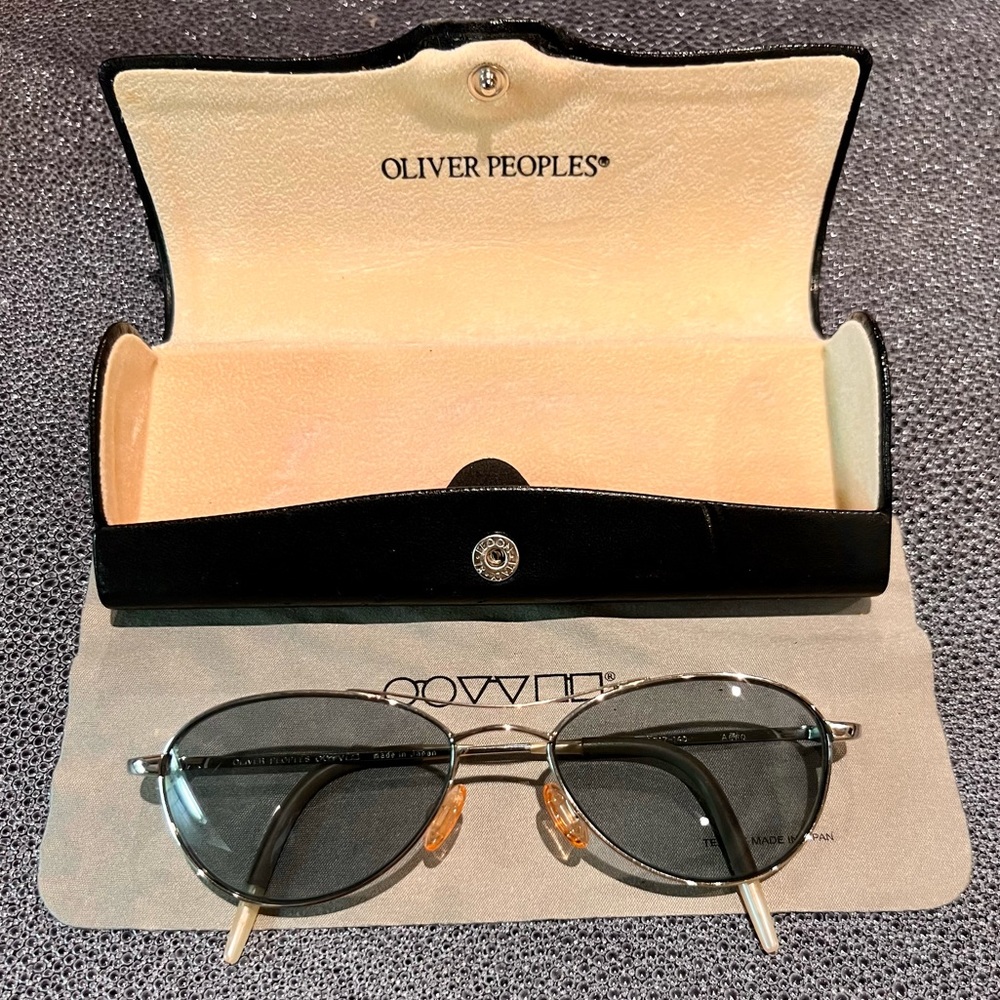 Oliver Peoples aviator sunglasses. Silver frames with ash blue lenses.
